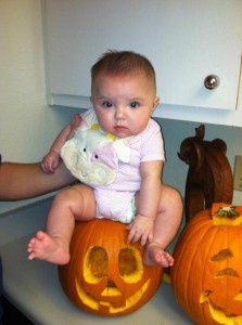 Little ladybug and her first pumpkin